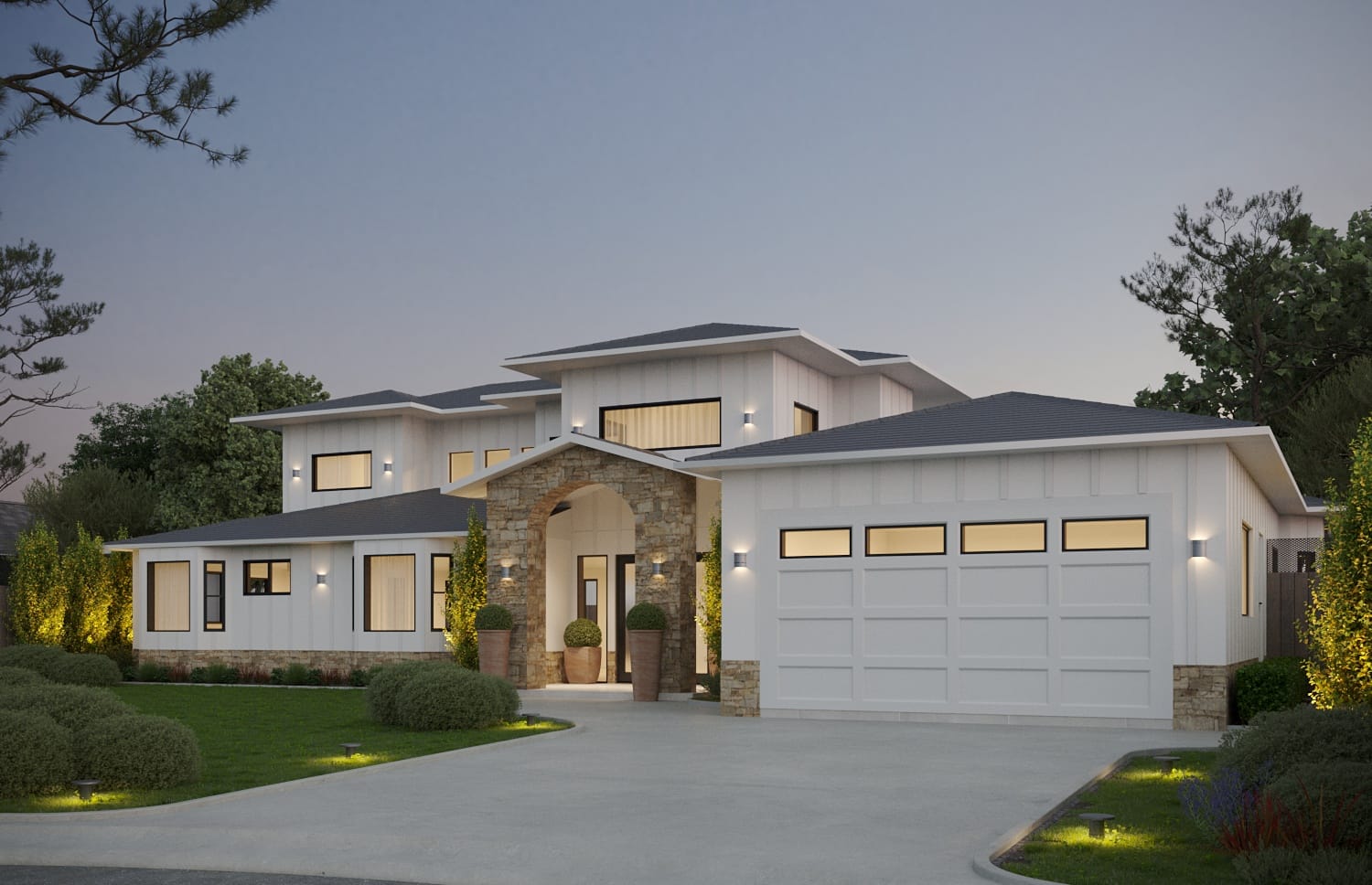 Angled dusk view of the same transitional house showing the three-car garage wing and landscape uplighting along the frontage