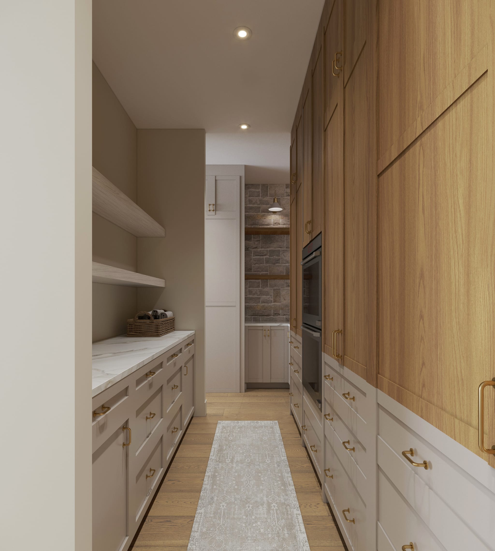 Butler’s pantry corridor with painted shaker cabinetry, marble counter, oak tall units, brass pulls and a runner leading to a stone-walled scullery